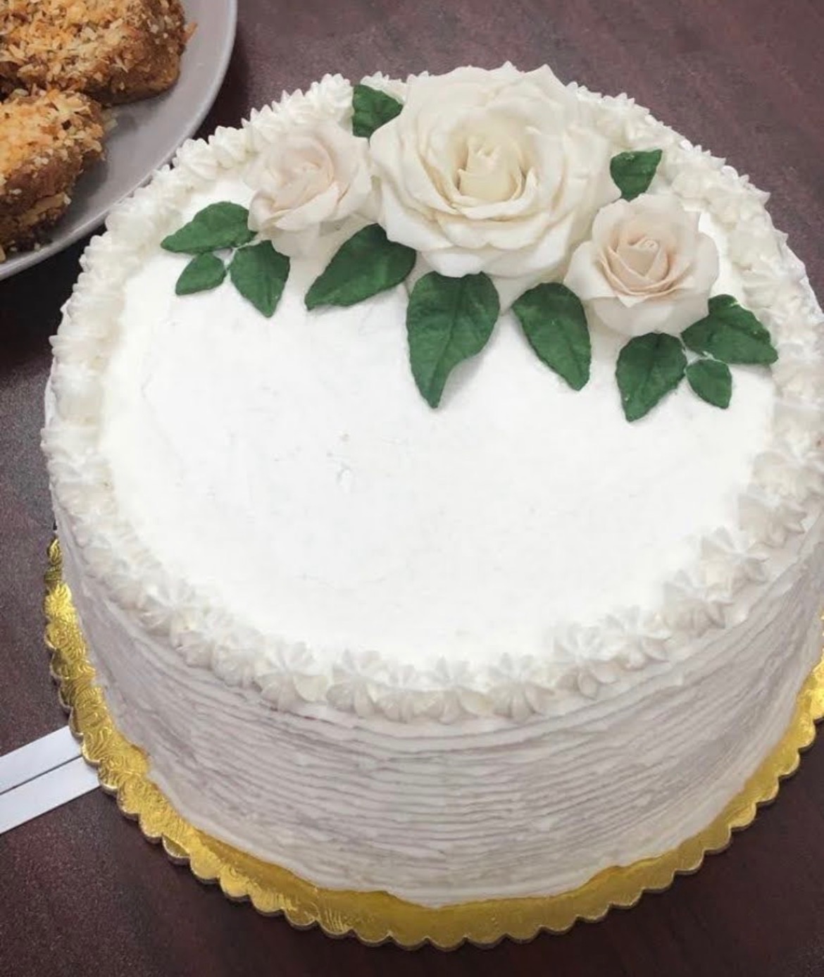 Classic wedding cake with three cream sugar roses
