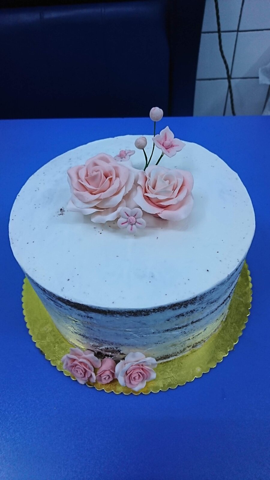 Naked cake with pink sugar roses