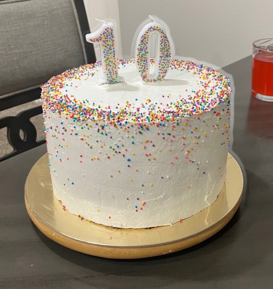 Buttercream birthday cake with rainbow sprinkle border