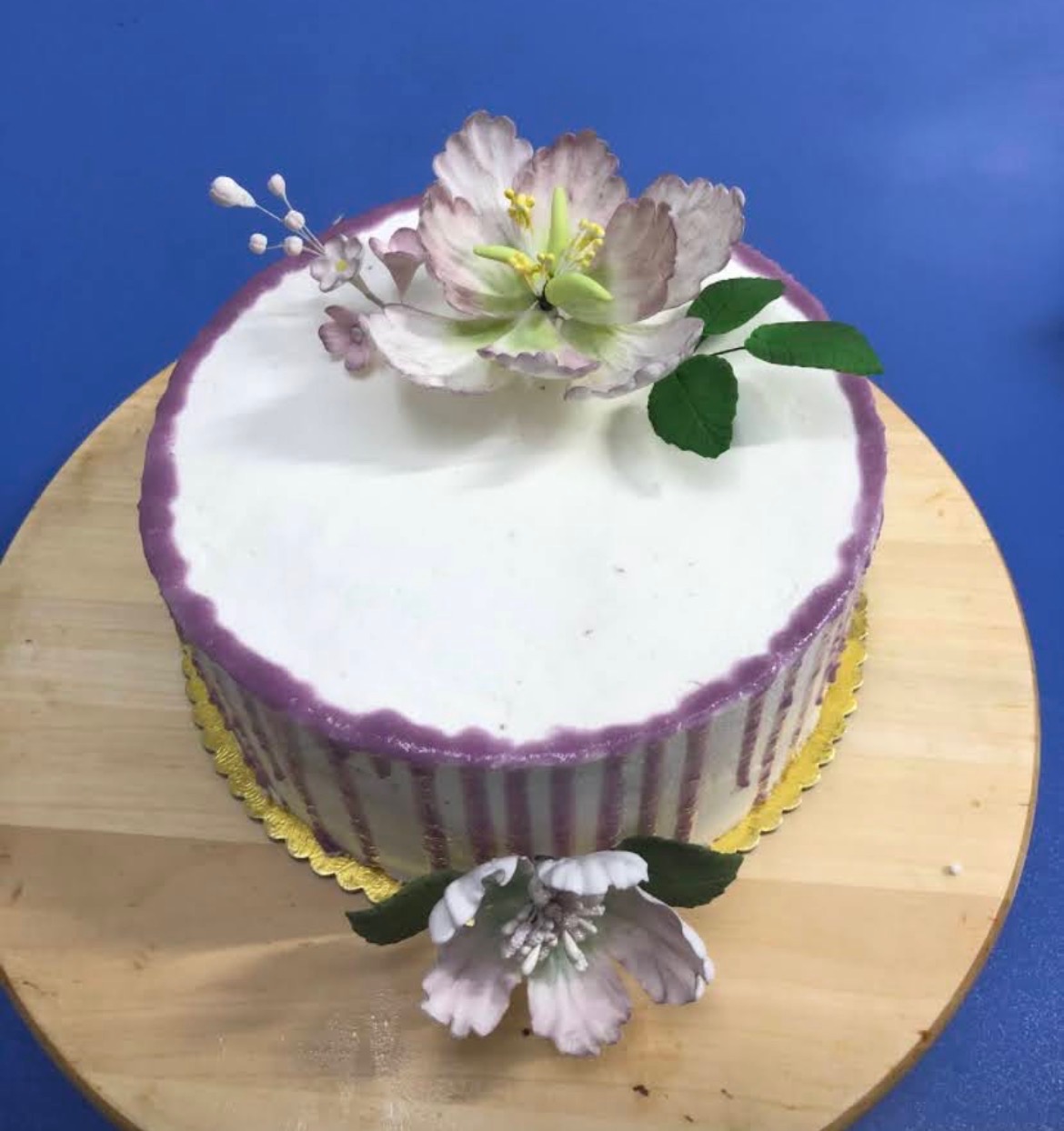 Makeup-themed birthday cake with fondant details