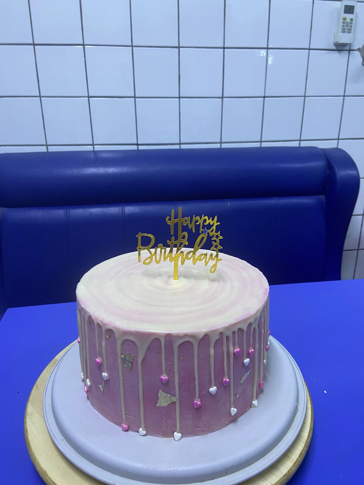 Two party cakes with drip and candy toppings