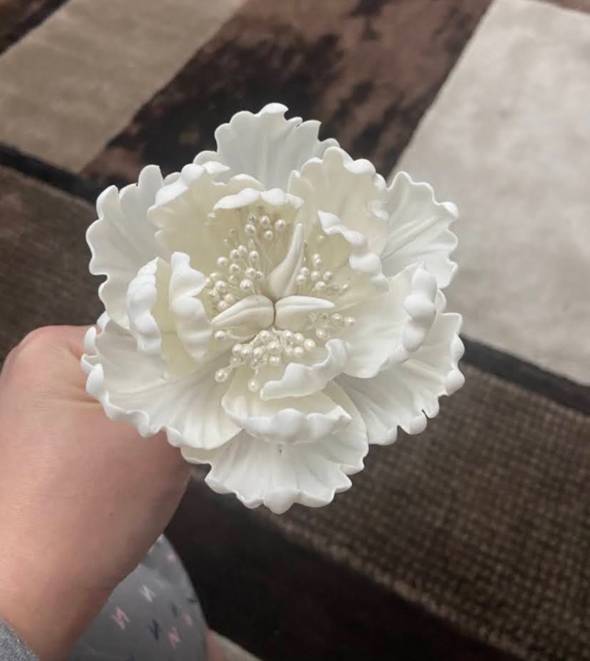 White ruffled sugar peony with pearl stamens