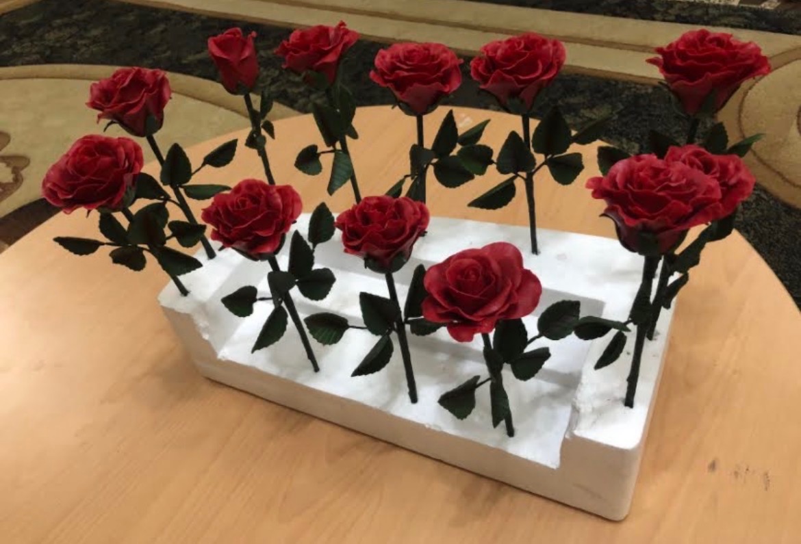 Red sugar roses with handcrafted leaves